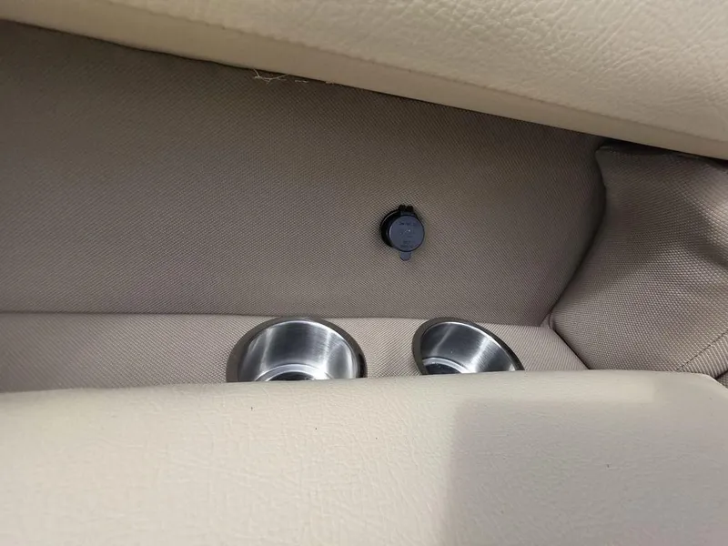 Slide: The Image of Interior of 2025 Veranda VR22RC Tri-Toon with cup holders and power outlet. - 15