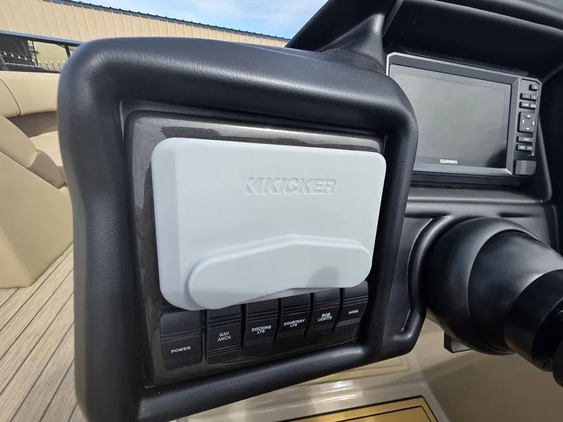 Slide: The Image of Control panel of 2025 Veranda VR22RC Tri-Toon with Kicker audio system and Garmin display. - 19