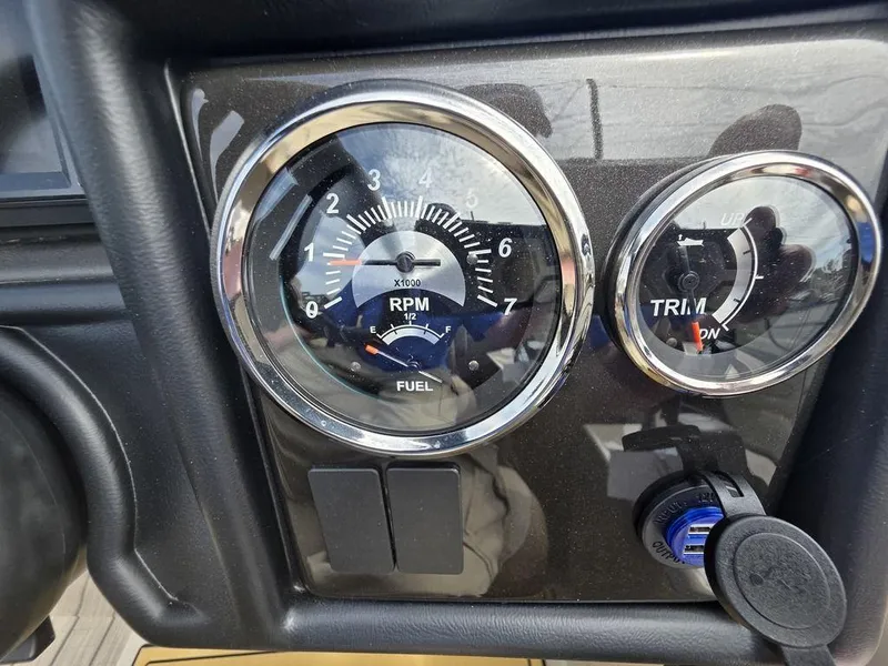 Slide: The Image of Dashboard of 2025 Veranda VR22RC Tri-Toon showing RPM and trim gauges. - 23