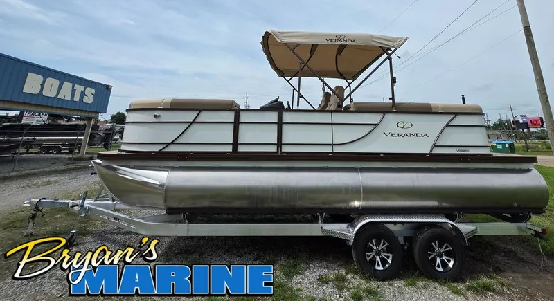 Slide: The Image of 2025 Veranda VR22RC Tri-Toon boat on trailer at Bryan's Marine dealership. - 3