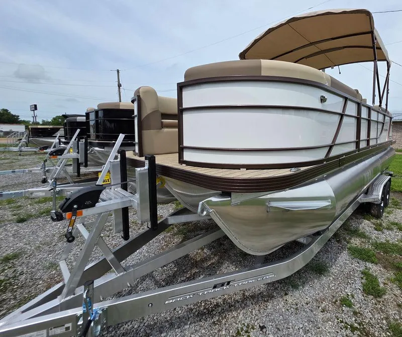 Slide: The Image of 2025 Veranda VR22RC Tri-Toon boat on trailer, featuring sleek design and canopy. - 30
