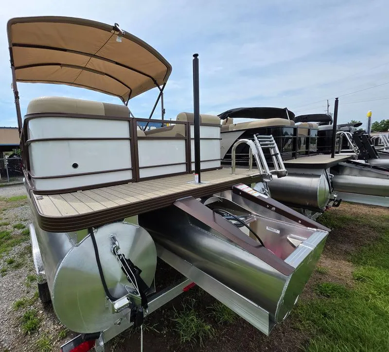 Slide: The Image of 2025 Veranda VR22RC Tri-Toon pontoon boat with canopy, displayed outdoors. - 31