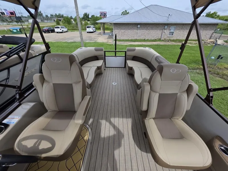 Slide: The Image of 2025 Veranda VR22RC Tri-Toon interior with luxurious seating and modern design. - 32