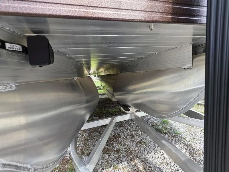 Slide: The Image of Underneath view of 2025 Veranda VR22RC Tri-Toon, showcasing aluminum pontoons and structural details. - 33