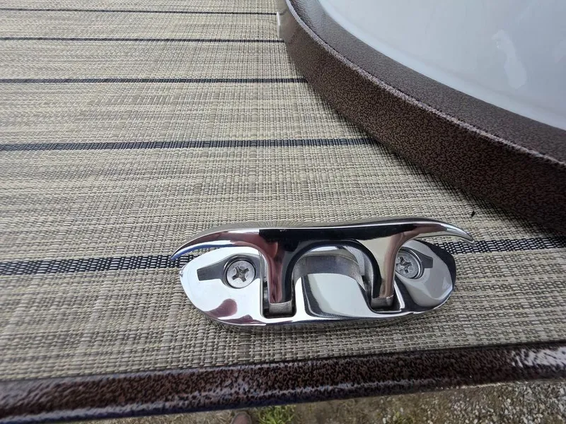 Slide: The Image of 2025 Veranda VR22RC Tri-Toon deck with chrome cleat on textured surface. - 36