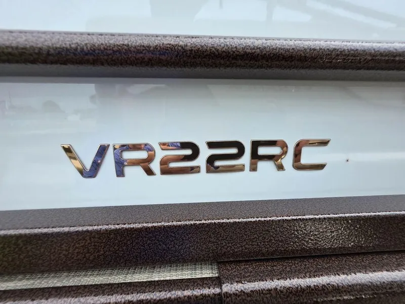 Slide: The Image of Close-up of 2025 Veranda VR22RC Tri-Toon model nameplate on boat exterior. - 38