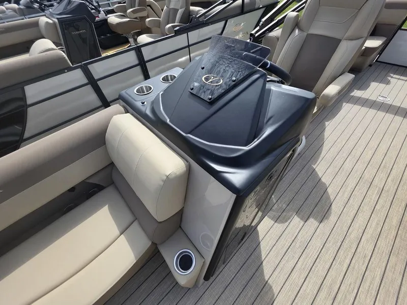 Slide: The Image of 2025 Veranda VR22RC Tri-Toon boat interior with steering console and seating. - 4