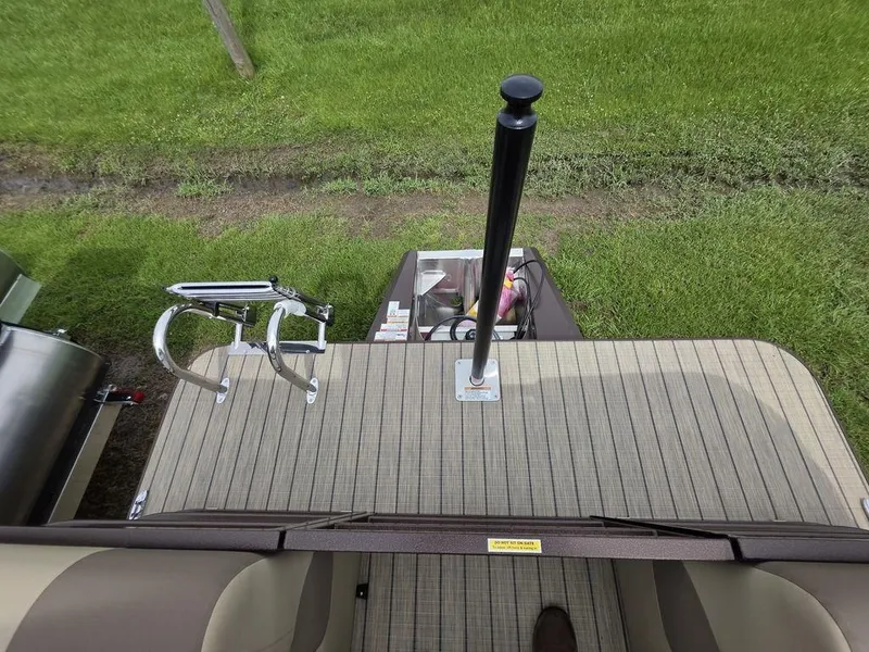 Slide: The Image of 2025 Veranda VR22RC Tri-Toon deck with ladder and pole, viewed from above. - 44