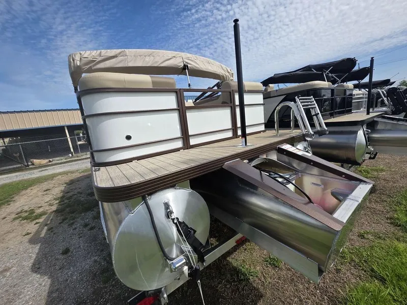 Slide: The Image of 2025 Veranda VR22RC Tri-Toon boat with sleek design and modern features, docked outdoors. - 8