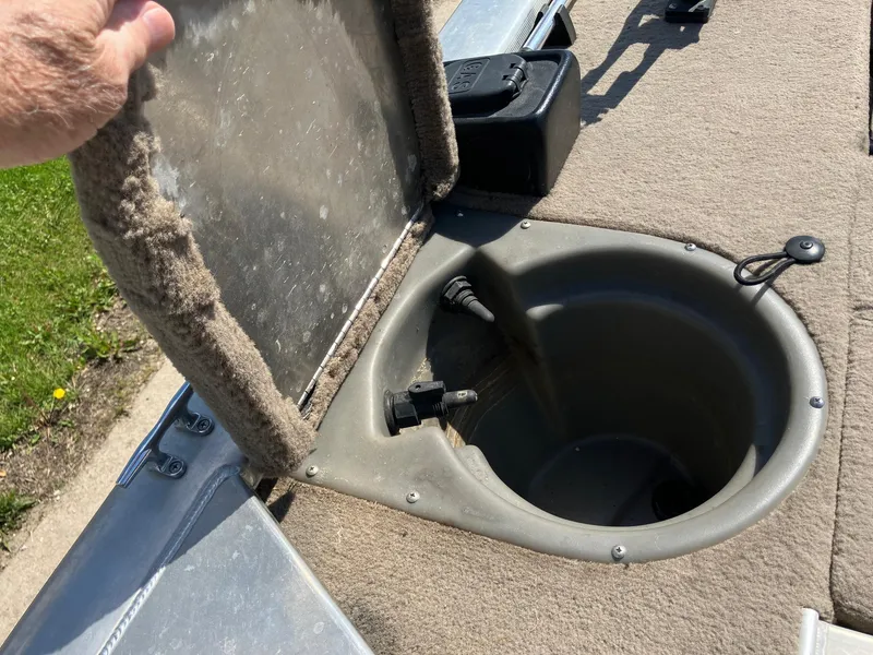 Slide: The Image of 2007 Tracker Pro Crappie 175 livewell compartment with open lid, showing interior details. - 12