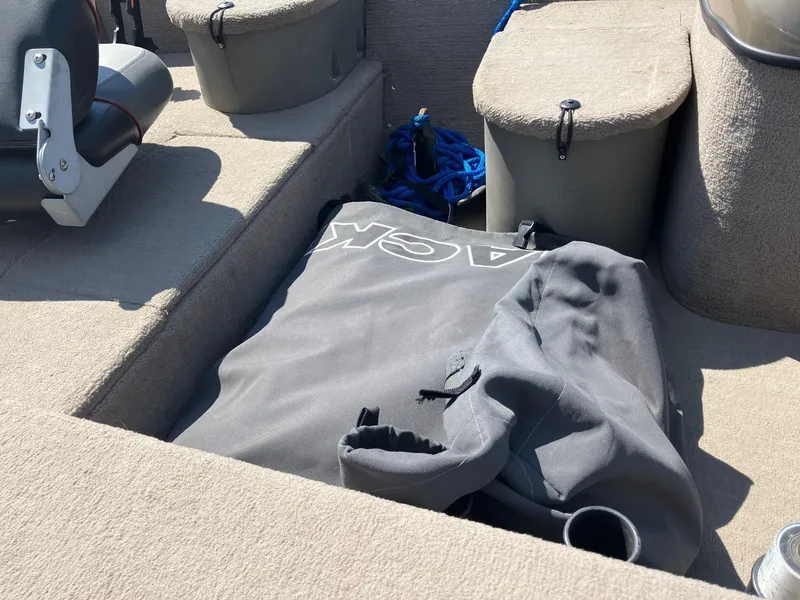 Slide: The Image of 2007 Tracker Pro Crappie 175 boat interior with storage compartments and gear. - 9