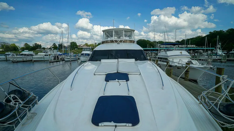 Slide: The Image of Luxury Viking Princess 68 yacht docked at marina, 2002 model, under a blue sky. - 13