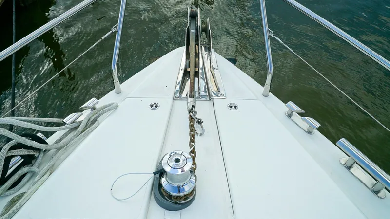 Slide: The Image of Bow of 2002 Viking Princess 68 yacht with anchor chain and railing. - 15