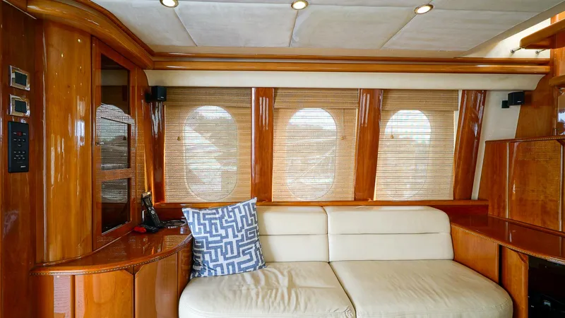 Slide: The Image of Luxurious interior of 2002 Viking Princess 68 yacht with elegant wood finish and plush seating. - 19