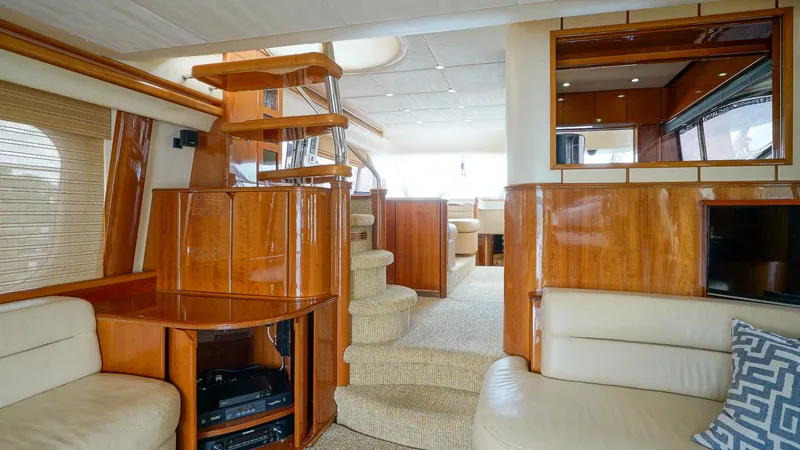 Slide: The Image of Luxurious interior of 2002 Viking Princess 68 yacht with elegant wood finishes and plush seating. - 20