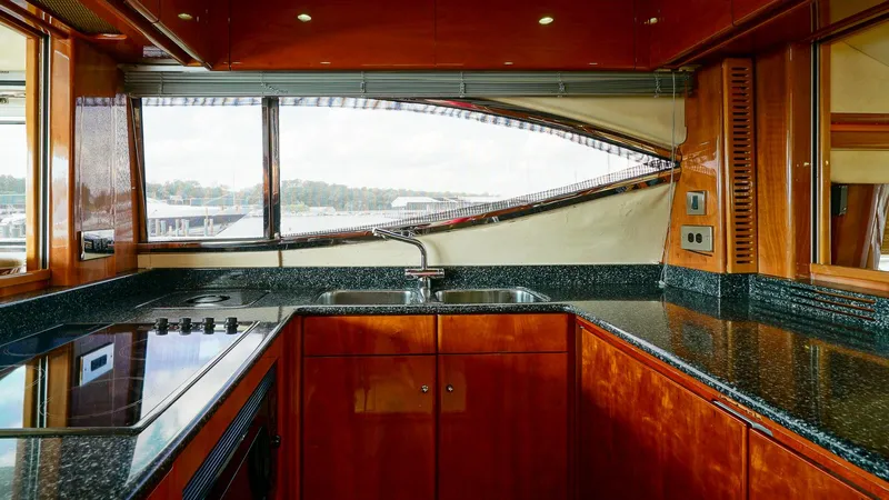 Slide: The Image of Luxurious kitchen interior of 2002 Viking Princess 68 yacht with sleek countertops and modern appliances. - 22