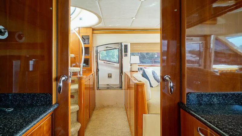 Slide: The Image of Luxurious interior of 2002 Viking Princess 68 yacht with polished wood and modern design. - 25