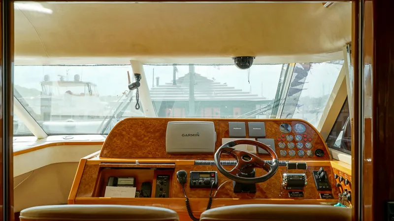 Slide: The Image of Cockpit of 2002 Viking Princess 68 yacht with steering wheel and navigation equipment. - 26