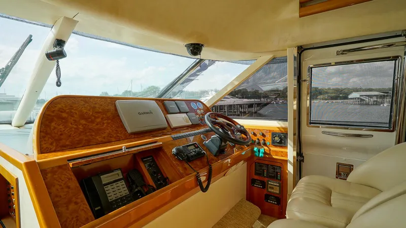 Slide: The Image of Luxurious 2002 Viking Princess 68 yacht cockpit with modern navigation equipment and plush seating. - 29