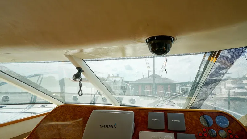 Slide: The Image of Helm view of 2002 Viking Princess 68 yacht with Garmin navigation system. - 32