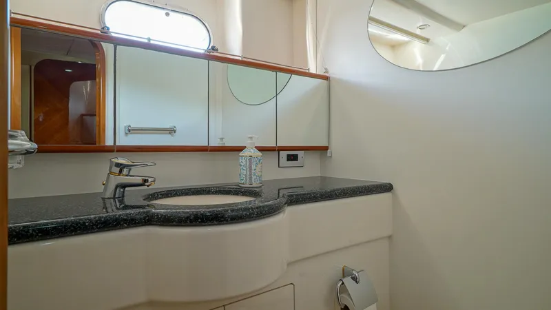 Slide: The Image of Luxurious bathroom in 2002 Viking Princess 68 yacht with modern fixtures and elegant design. - 44