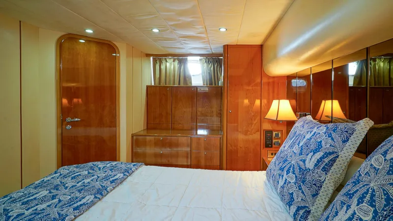 Slide: The Image of Luxurious cabin interior of 2002 Viking Princess 68 Sport Cruiser with elegant wood finish. - 48