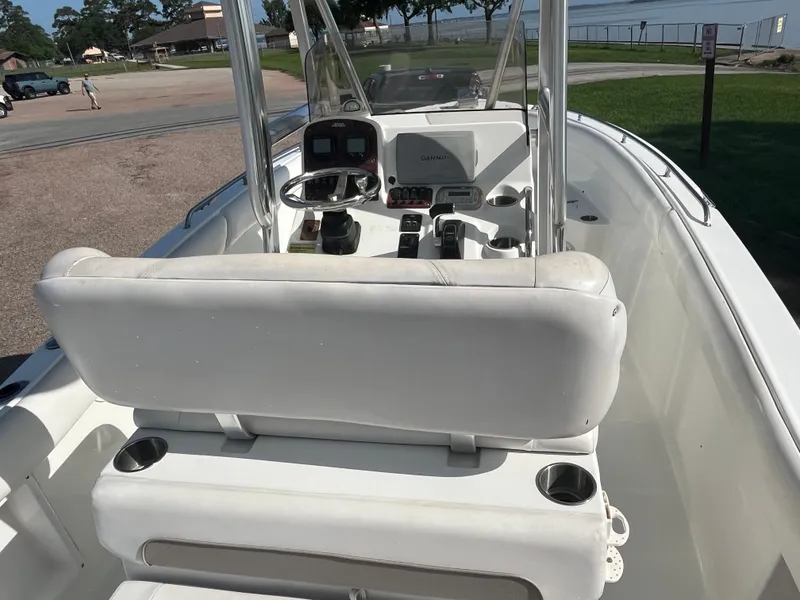 Slide: The Image of 2011 Sea Hunt Ultra 232 boat interior with steering console and seating. - 28