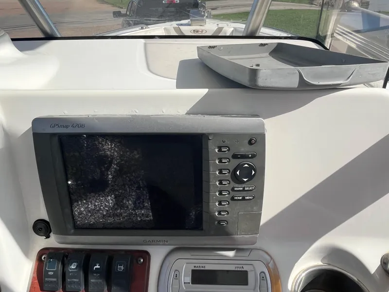 Slide: The Image of Control panel of a 2011 Sea Hunt Ultra 232 boat with Garmin GPS display. - 31
