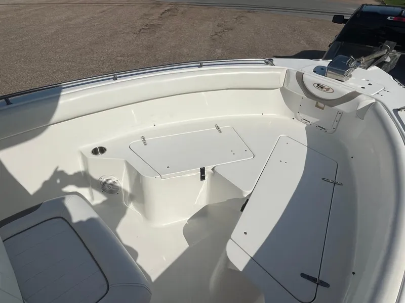 Slide: The Image of 2011 Sea Hunt Ultra 232 boat interior with seating and storage compartments. - 34