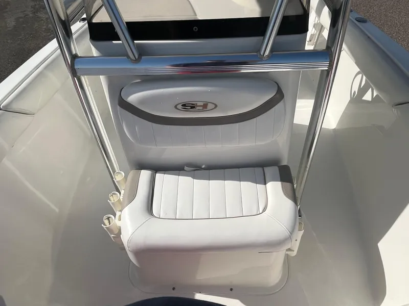 Slide: The Image of 2011 Sea Hunt Ultra 232 boat interior with white seating and stainless steel railings. - 35