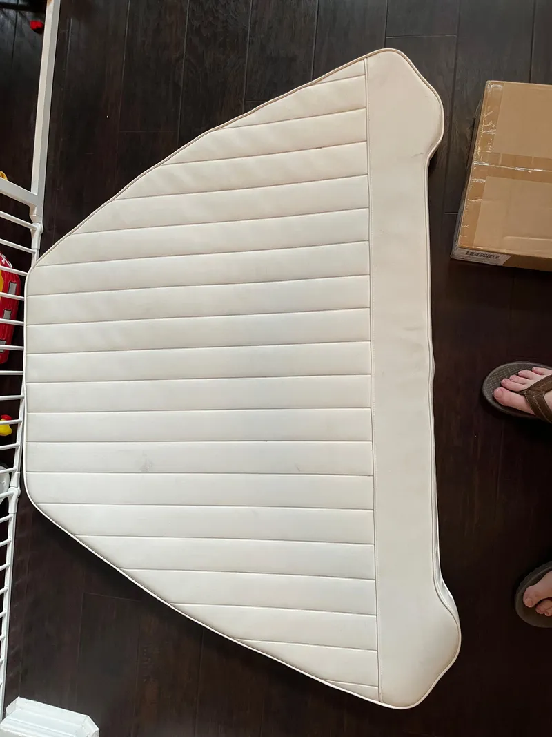 Slide: The Image of White boat cushion for 2011 Sea Hunt Ultra 232 on dark wood floor. - 44