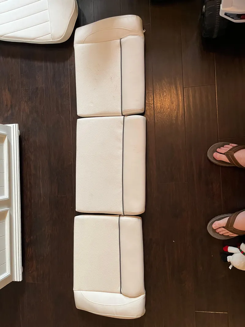 Slide: The Image of Boat seat cushions from a 2011 Sea Hunt Ultra 232 on wooden floor. - 45