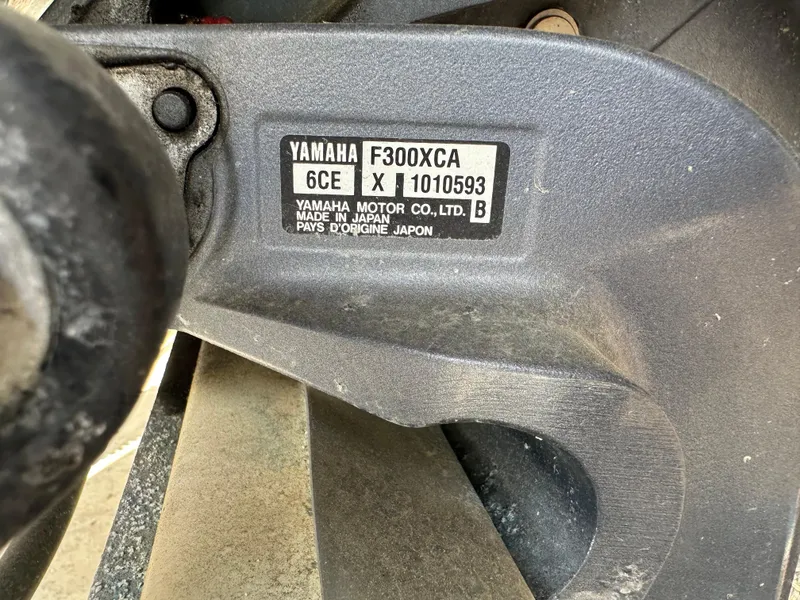 Slide: The Image of Yamaha F300XCA engine label on 2014 Scout 245 Dorado boat, close-up view. - 18