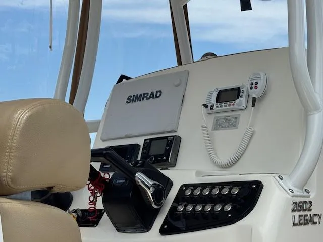 Slide: The Image of Helm of 2020 NauticStar 2602 Legacy boat with Simrad electronics and controls. - 14