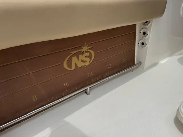 Slide: The Image of 2020 NauticStar 2602 Legacy boat interior with branded measuring board. - 20