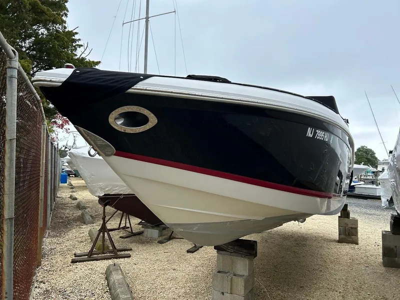 Slide: The Image of 2010 Cobalt 262 boat on blocks in a marina storage area. - 1