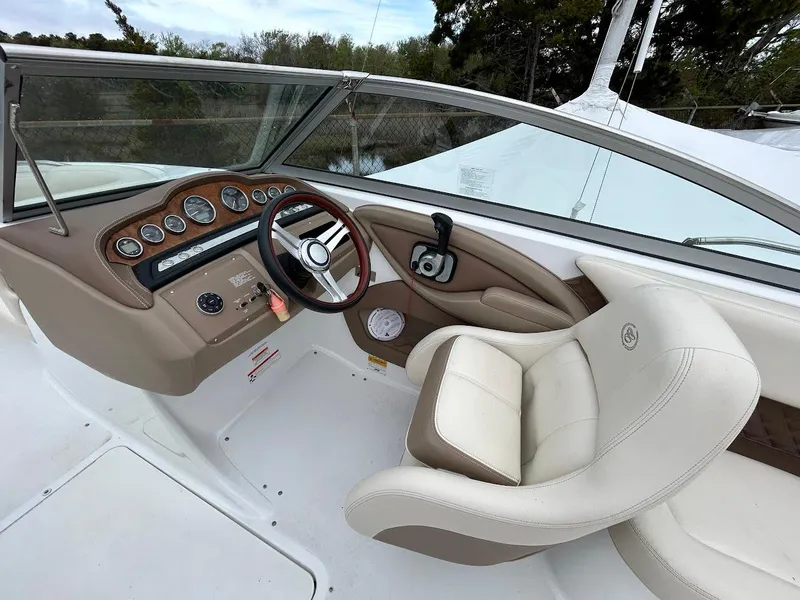 Slide: The Image of 2010 Cobalt 262 boat interior with steering wheel and dashboard controls. - 6