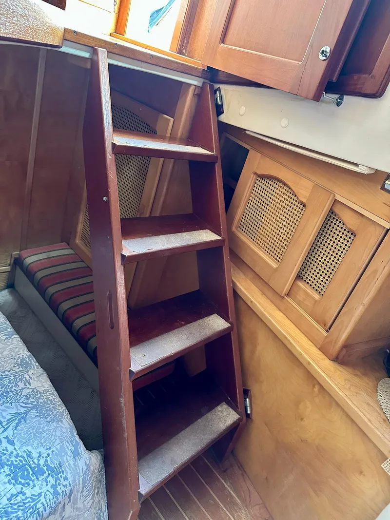 Slide: The Image of Interior of 1989 Pilgrim Trawler with wooden steps and cabin storage. - 11