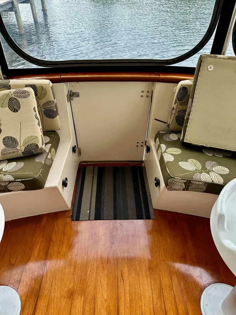 Slide: The Image of Interior of 1989 Pilgrim Trawler with patterned cushions and wooden flooring. - 33