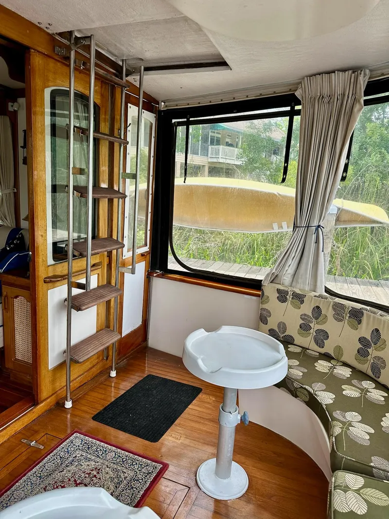 Slide: The Image of Interior of 1989 Pilgrim Trawler with ladder, seating, and window view. - 35