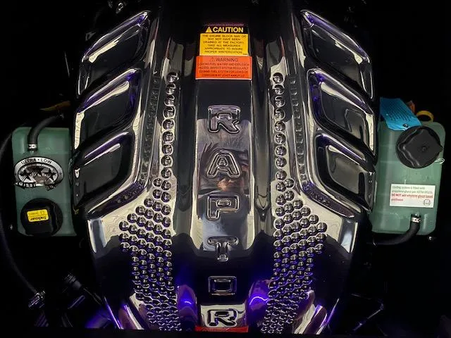 Slide: The Image of 2025 Tigé Ultré 25ZX engine with Raptor branding, featuring a sleek metallic design. - 9