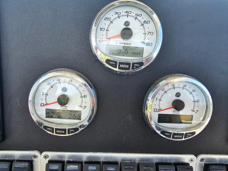 Slide: The Image of Dashboard gauges of a 2010 Triton 301 CC boat, displaying speed and RPM. - 29