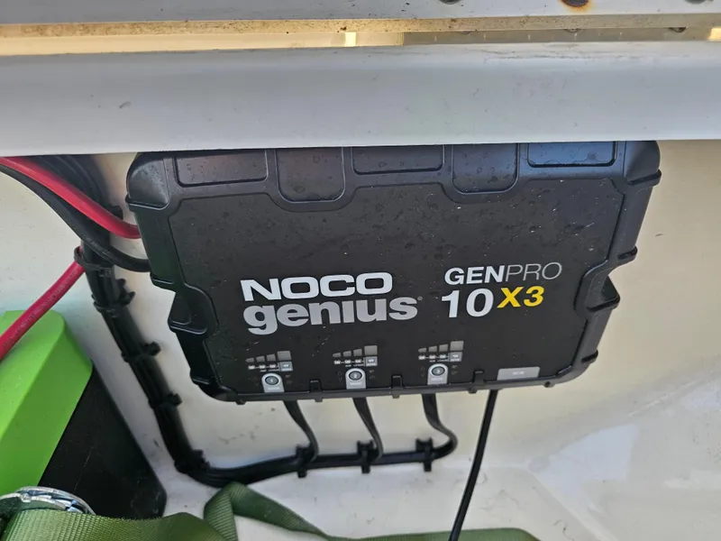 Slide: The Image of NOCO Genius GENPRO 10X3 charger installed on a 2010 Triton 301 CC boat. - 37