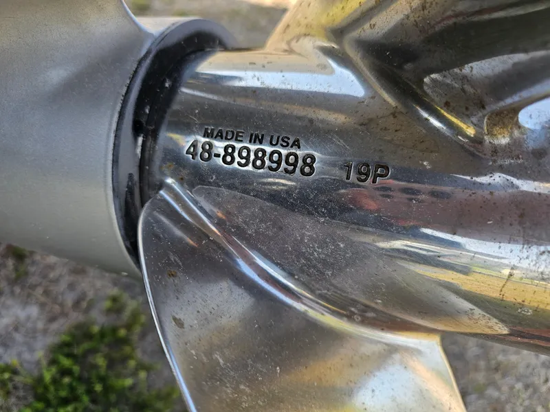 Slide: The Image of Close-up of a Triton 301 CC 2010 boat propeller with serial number 48-898998. - 6