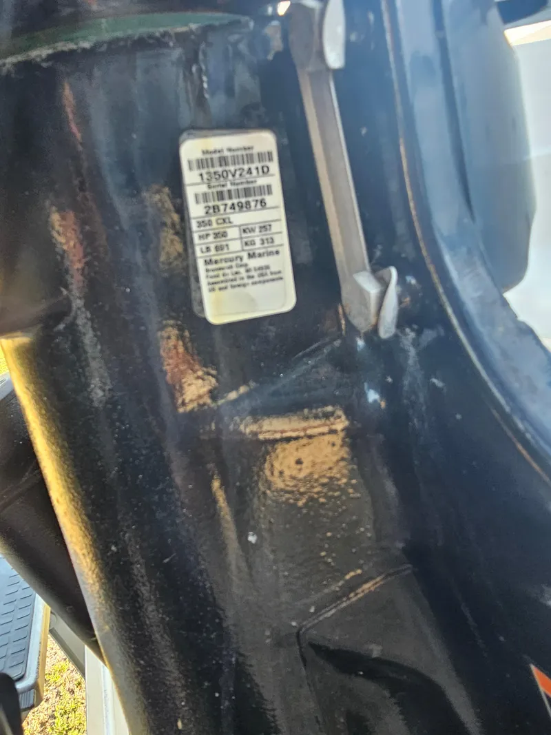 Slide: The Image of Label on a 2010 Triton 301 CC boat engine, showing model and serial numbers. - 7