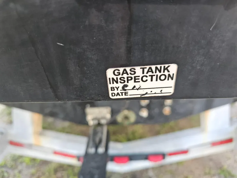 Slide: The Image of Gas tank inspection sticker on 2010 Triton 301 CC boat trailer. - 9