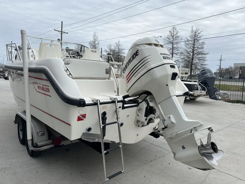 Slide: The Image of 1998 Boston Whaler 21 Conquest boat with Evinrude outboard motor on trailer. - 3