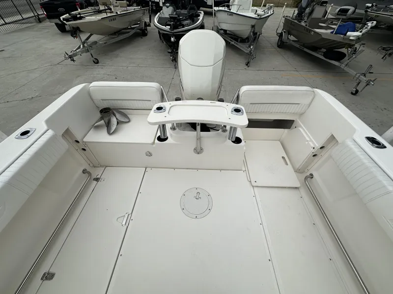 Slide: The Image of 1998 Boston Whaler 21 Conquest boat interior with seating and storage compartments. - 5