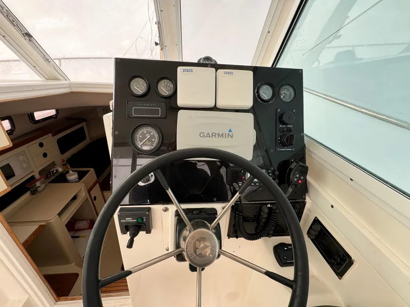 Slide: The Image of 2003 Albin 28 TE Flush Deck helm with Garmin navigation system and gauges. - 15