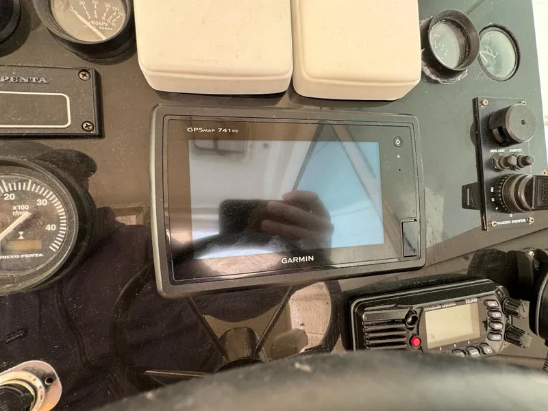 Slide: The Image of Dashboard of 2003 Albin 28 TE FLUSH DECK with Garmin GPS and control instruments. - 16